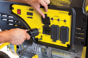 a man is working on a yellow and black machine.