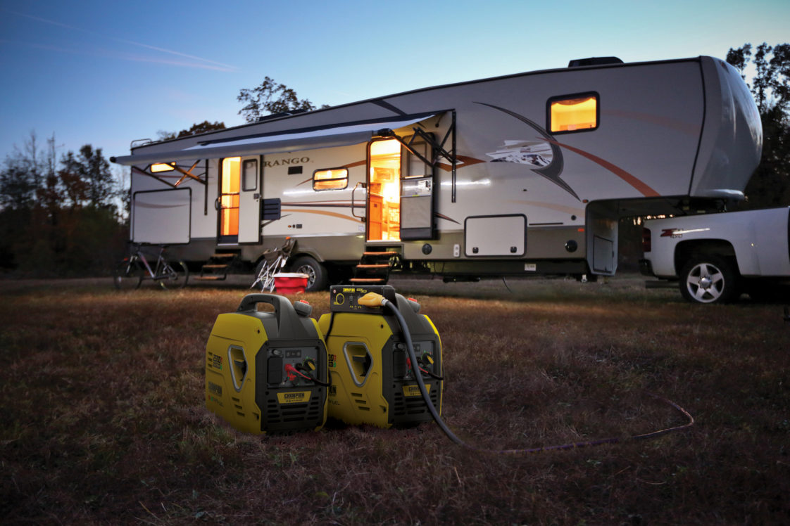 Champion generators in front of a 5th wheel at dusk.