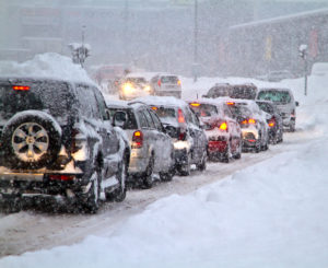 a bunch of cars that are in the snow.