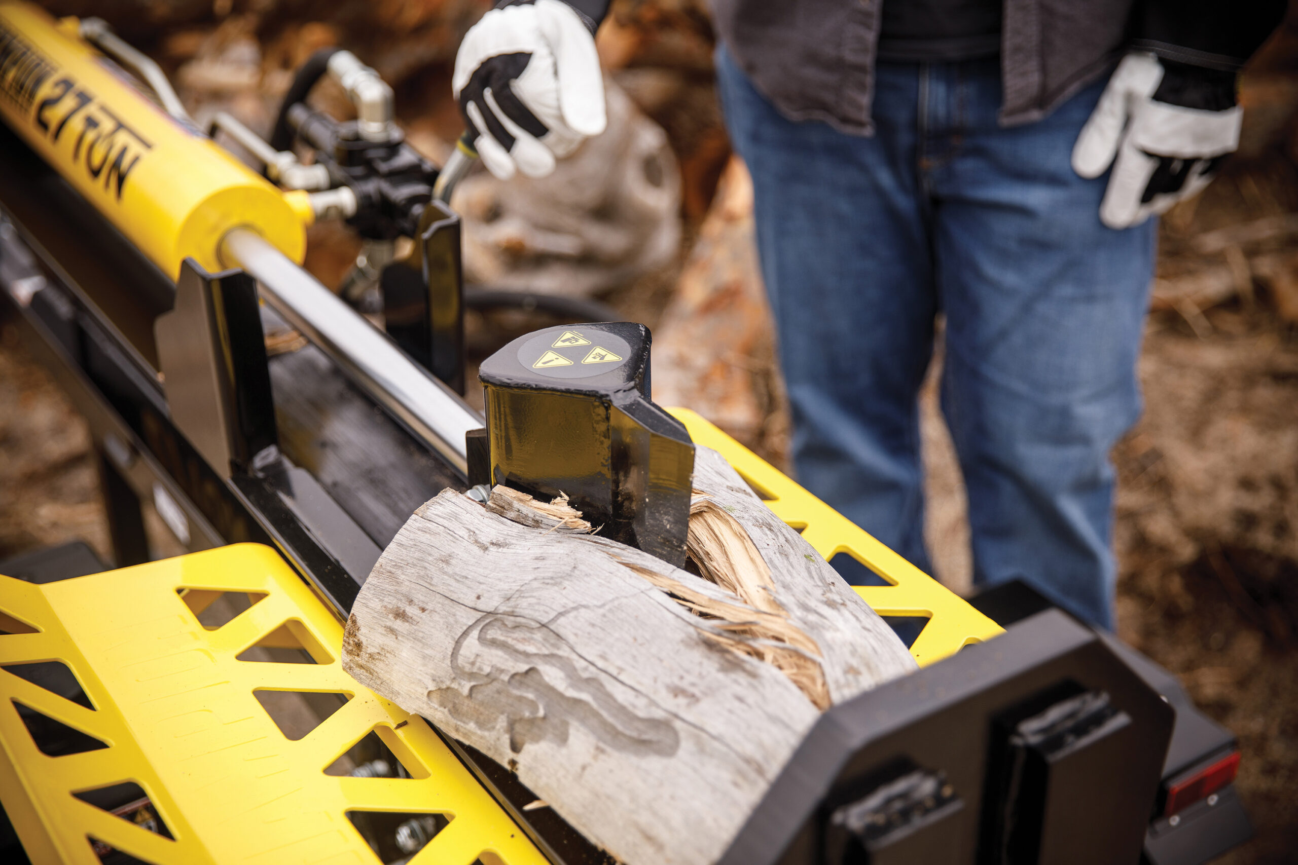 a man working on a piece of wood.