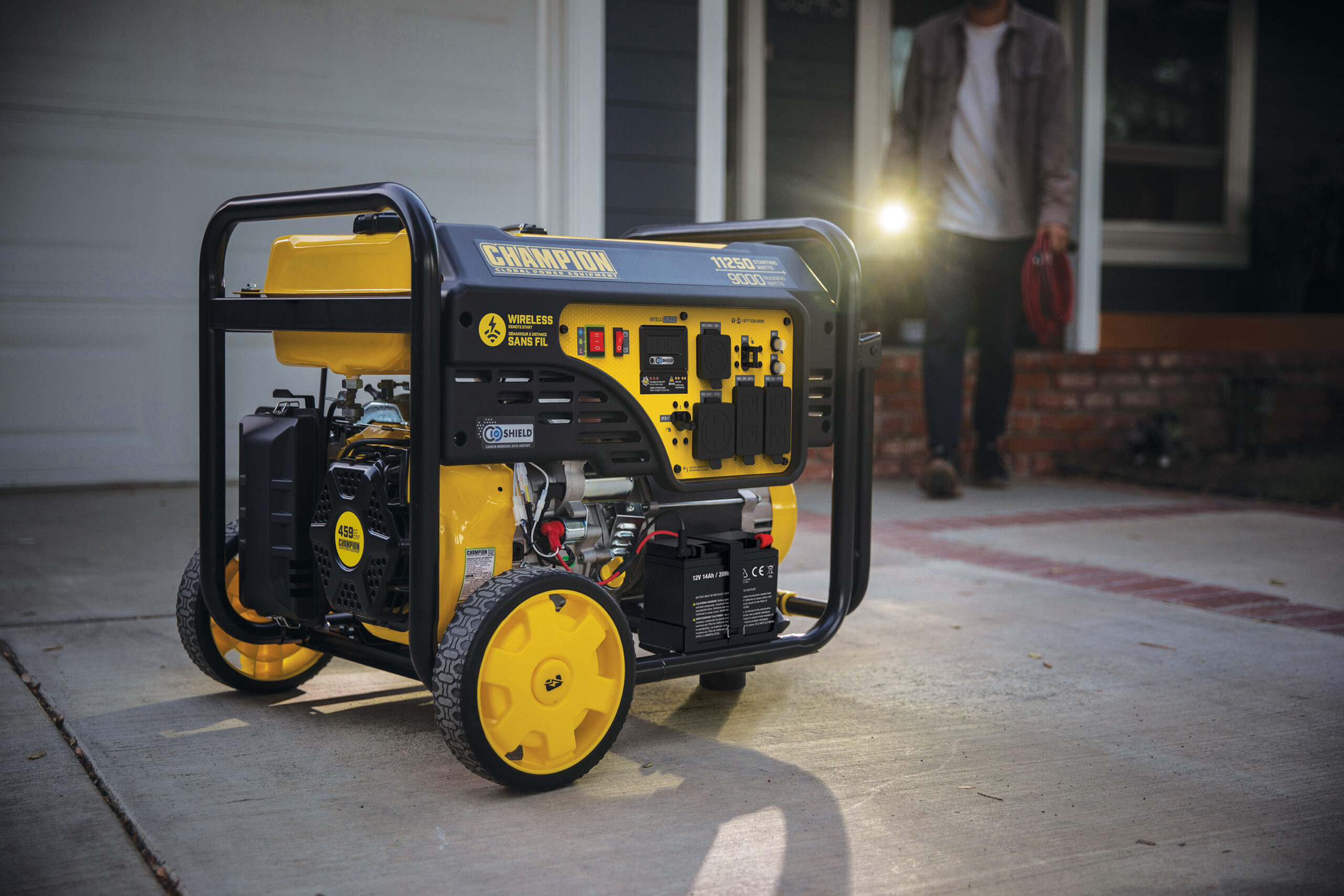 a yellow and black generator sitting on top of a sidewalk.
