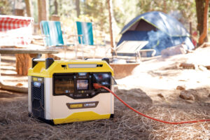 a yellow and white portable generator sitting on the ground.