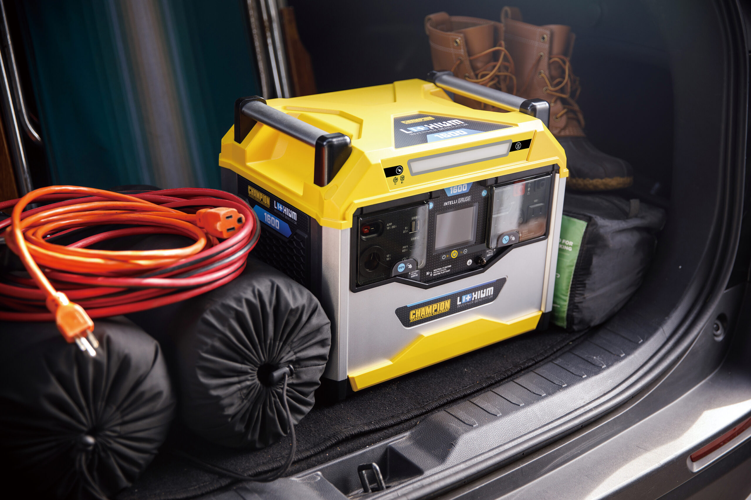 a yellow and black machine sitting in the trunk of a car.